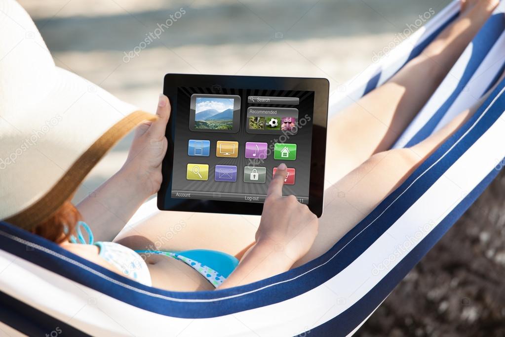 Visitor using a tablet to browse digital travel information
