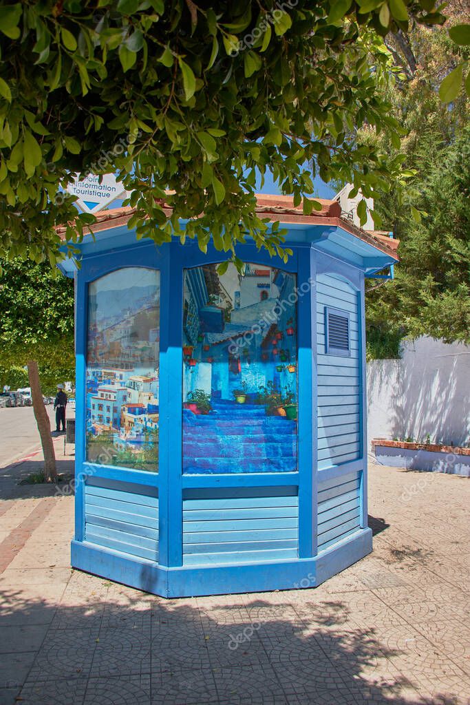 Visitors browsing brochures and maps at a mobile visitor information center
